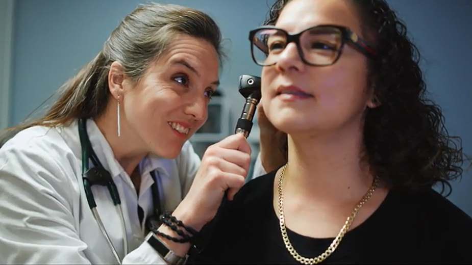 Doctor examines patients ear
